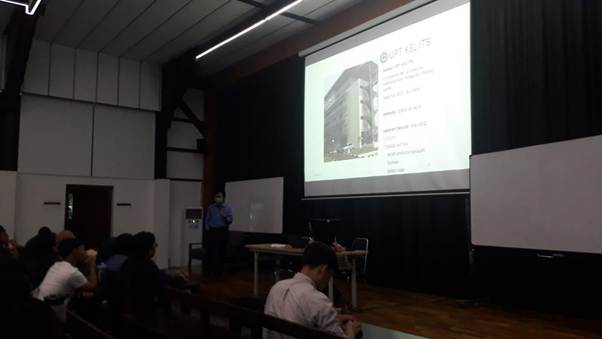 A person sitting in front of a projector screen

AI-generated content may be incorrect.